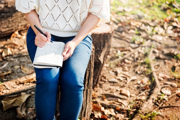 A person journaling outdoors in nature, capturing their thoughts and spiritual aspirations in a notebook with a pen, under natural sunlight.