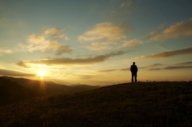 A person standing on a hilltop at sunset, gazing towards the horizon, symbolizing overcoming challenges and focusing on the desired outcome.