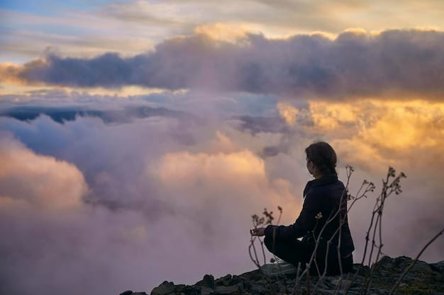 A person sitting peacefully on a mountaintop at sunrise, meditating with closed eyes, symbolizing self-reflection, inner peace, and connection with nature.