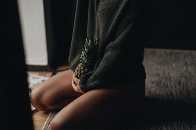 A close-up of hands gently resting on knees during meditation, with soft, diffused lighting creating a calm and peaceful atmosphere. The background is slightly blurred, emphasizing the focus on the hands and the act of meditation.