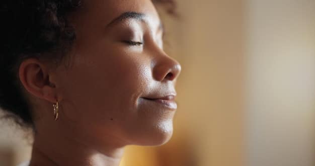 A close-up shot of a person's face in deep concentration during meditation, eyes closed, with a subtle smile indicating inner peace.