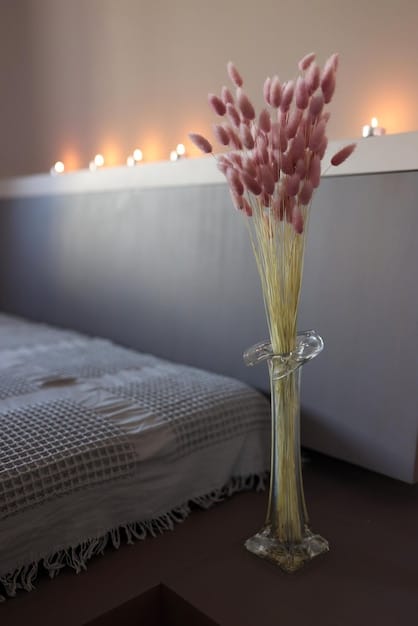 A minimalist and serene bedroom setting with soft lighting and calming colors. A comfortable bed is neatly made with plush pillows and blankets, and a diffuser releases a gentle mist of essential oils. The room exudes a peaceful and inviting atmosphere, emphasizing the importance of creating a conducive environment for meditation and sleep.