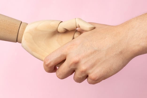 Close up shot of two pairs of hands. One pair is clasped together in a show of empathy and support. Each hand has zodiac sign symbols faintly visible on the skin.