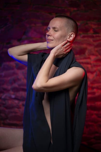 A vibrant photo of a Leo individual confidently performing on stage in a play, bathed in warm spotlight. Their expression is animated, showing their passion and charisma.