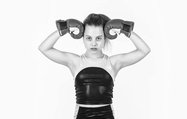 A person with an Aries zodiac symbol subtly incorporated wears boxing gloves and is hitting a punching bag with determination in a modern, well-lit gym.