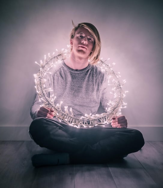 A person meditating with scales overlaid on their chest, representing the internal struggle to balance personal needs vs relationship harmony.