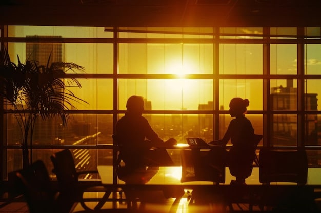 A modern office scene with diverse people collaborating, bathed in soft, golden light. Emphasize the atmosphere of growth and opportunity, with charts showing upward trends and a sense of optimism in the air.