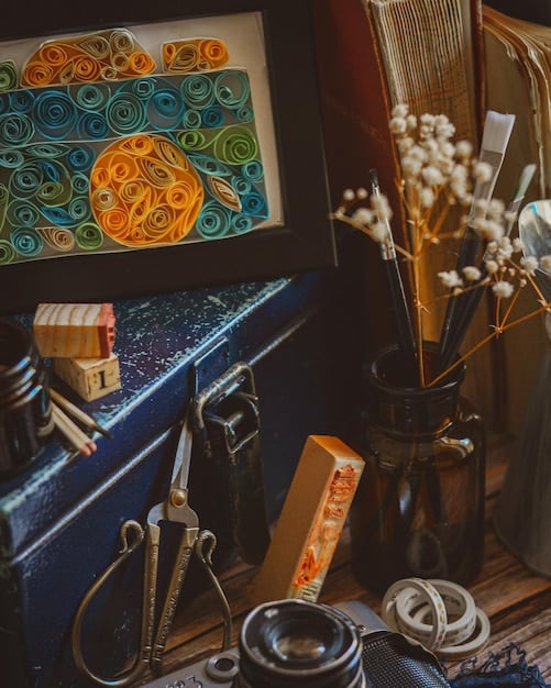 A vibrant art studio filled with paintings, sculptures, and various creative tools. The lighting is warm and inviting, highlighting the energy and inspiration that Jupiter's influence brings to creative ventures.