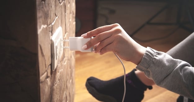 Person unplugging electronic devices from wall sockets. The image gives a practical visual guide on how to protect electronics.