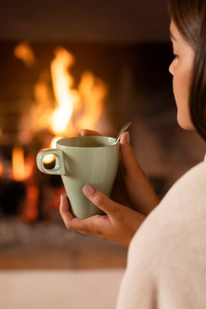 A close-up shot of hands gently holding a cup of tea, with steam rising and a blurred background of a cozy, warmly lit room, symbolizing the act of savoring the present moment with mindful awareness.