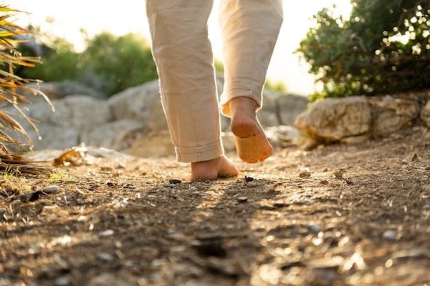 A close-up shot of feet walking on a path, symbolizing the focus on each step in walking meditation. The image should emphasize the connection between the feet and the ground.