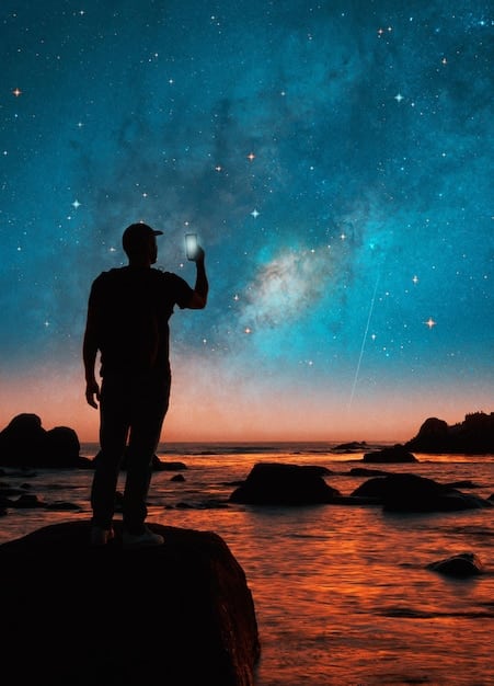 An image depicting a person looking at a night sky filled with stars and planets, with glowing lines connecting the stars to form zodiac symbols. The person is holding a tablet displaying an astrological chart.