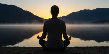 Serene person meditating by lake at sunrise for spiritual clarity