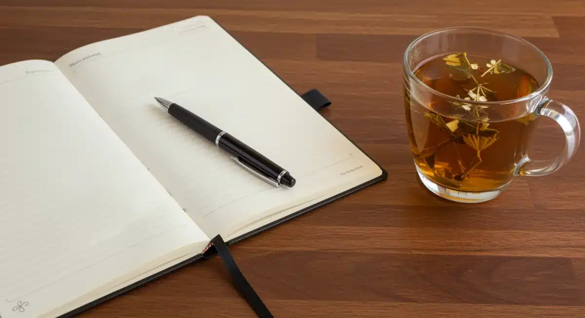 Open journal and pen for self-reflection and spiritual insight