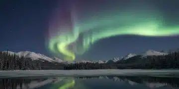 Stunning Aurora Borealis over a serene winter landscape in 2026