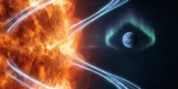 Powerful solar flare erupting from sun, Earth in background with aurora, illustrating solar activity impact.